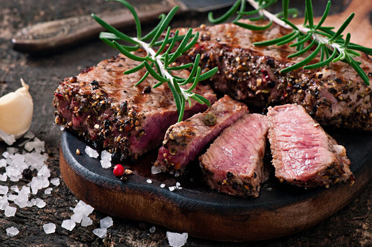 Delicious grass fed grilled New York strip steak with spices.